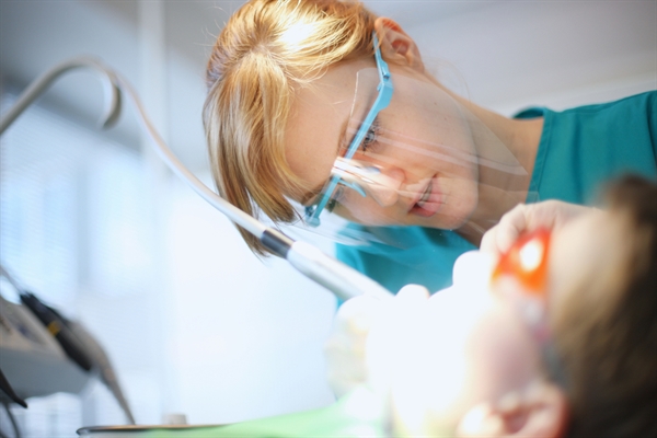 Dental procedure with patient and tools